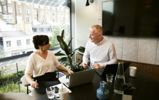 Man and woman discussing and sharing ideas