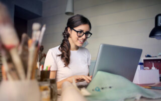 Photo of woman using her laptop