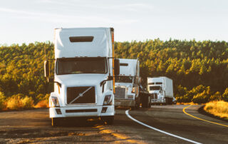 White volvo semi truck on side of road