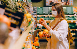 Woman wearing mask in supermarket