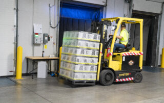 Man riding on yellow forklift